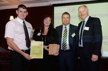 Matt Howarth (left), Vicky Hughes (second left) and Geoff Hadfield (far right)of Hadfield Wood Recyclers receive their award from Nick Taylor (second right) of Abraservice UK