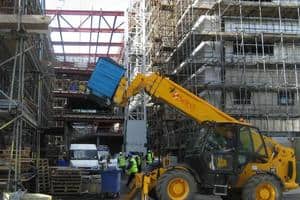 Waste being taken away for recycling from a construction site, which will soon have to produce a site waste management plan