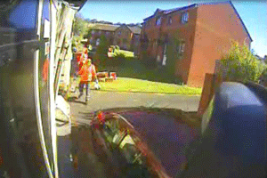A mounted camera catches the moment a driver tries to pass a Biffa vehicle, regardless of the employee in their path