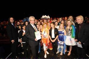 Andrew Perkins of Aylesford Newsprint presents students from Amersham School with the Outstanding School Award