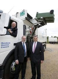 Cllr Roger Arthur, Horsham cabinet member with responsibility for operational services, and Ian Joplin, head of operational services at Horsham, take receipt of a demountable side from Roger Smee, regional sales manager at Dennis Eagle