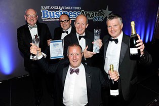 The Sackers Recycling team and Terry Hunt, EADT Editor in Chief, celebrate the companys accolade.