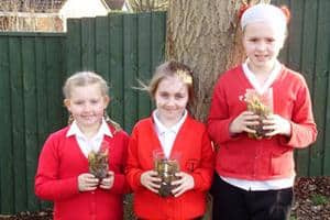 Year four students at Cowes primary with their ‘rot pots' which demonstrate the composting process