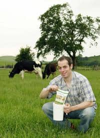 Iwan Jones, one of the farmers producing Calon Wen milk, shows off the new packaging system