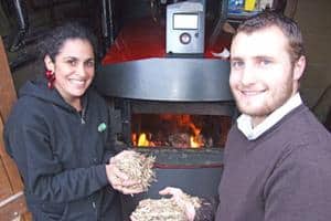 Ruth Andrade of Lush and Justin Dampney of Eco with the fuel that will be used to power the cosmetic giant's biomass boiler