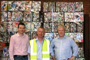 The team from Mason Metals with bales of used aluminium cans ready to be sent to Novelis. (l-r) Neil Woodall, John Shaw and Andrew Jones