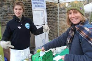 Ruth Westcott from Waste Watch with resident Anna-Marie O'Donnell making a pledge as part of the NLWA's food waste minimisation initiative