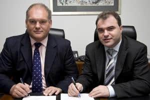 (l-r) Doug Aitchison, managing director of Oran Waste UK Ltd, finalises the takeover with Noel Hanley, chairman of Response Group