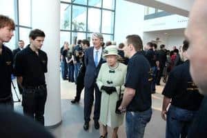 Her Majesty meets staff at the Palm Paper mill in Norfolk, including, to her left, chief executive of the Palm Group Wolfgang Palm