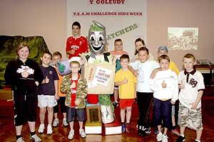 Children from Y Goleudy Kidz club with Rhys Cycle