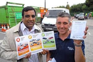 (l-r) Cllr Shaffaq Mohammed and Stephen Bradshaw, assistant HWRC manager at Veolia show the new green, amber and red traffic light system for vehicles and the permit booklet at Beighton HWRC