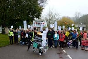 Over 100 Dulverton residents have demonstrated against proposals by Somerset county council to close four household waste and recycling centres