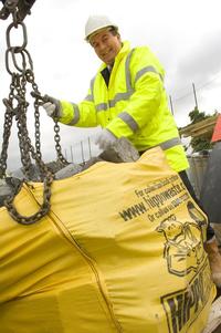 Mike Hallam, regional manager of the Tarmac scheme, with the first load to be recycled at the site of a new school in Lambeth