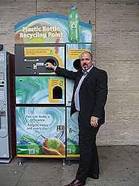 Dan Murphy, operations manager at the Milton Keynes shopping centre, puts a bottle into the reverse vending machine