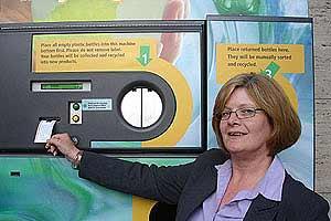 Carol Wakelin, cleaning manager at the Milton Keynes store, takes her voucher from the machine