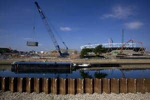 Waste is loaded onto a barge at the Olympic Park