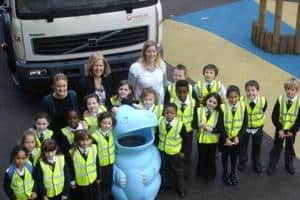 Children and teachers at Rosary RC Primary School, Camden with the recycling bin donated by Veolia