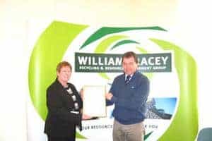 Michael Tracey is presented with an accreditation for good practice in health and safety at William Tracey's Paisley site by Anne Dolan of British Standards in April 2009