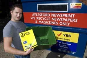 Adam Billiald, environment strategy manager of Yell, exhibits the Yellow Pages directory which can now be processed by Aylesford Newsprint
