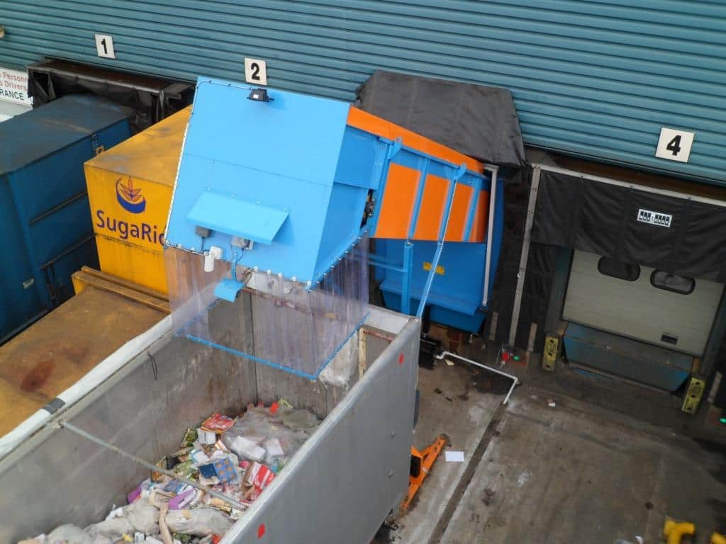 Material is deposited directly into a walking floor trailer before being transported for onward treatment