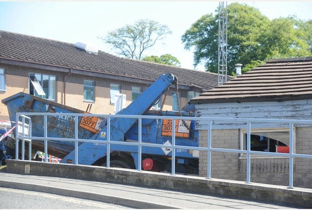 The skiploader had an attachment to take a second skip on a trailer