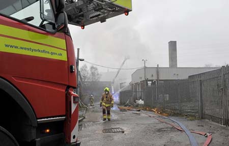 Firefighters tackle the blaze at the battery storage building
