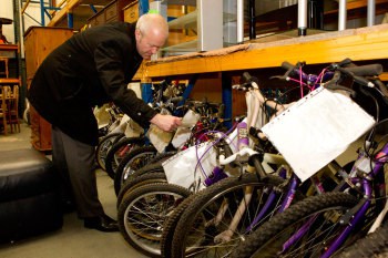 Paul Taylor with the refurbished bikes ready for sale at an Abacus store in Rochester