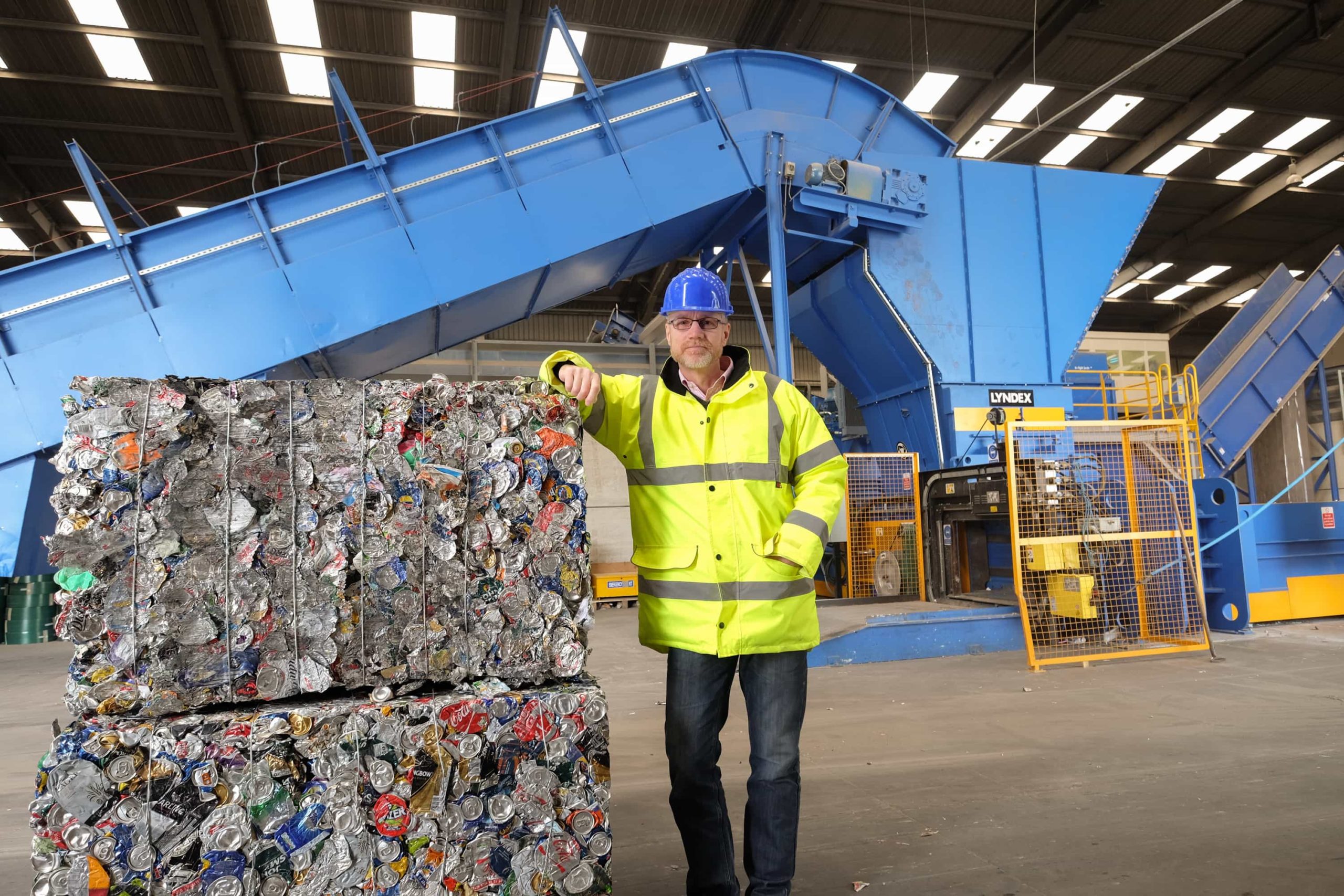 Gareth Godwin, manager at Ward Recycling, displays the company's new Lyndex baler