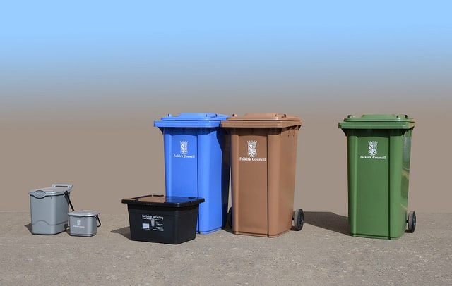 Residents are provided with a grey caddy for food waste, collected weekly, a black box for glass bottles and jars and small WEEE, a blue wheeled bin for commingled cans, paper and plastic (bottles and PTT) collected fortnightly, a brown bin for garden waste, also collected fortnightly, and a green bin for non-recyclable material that is collected every three under the new system